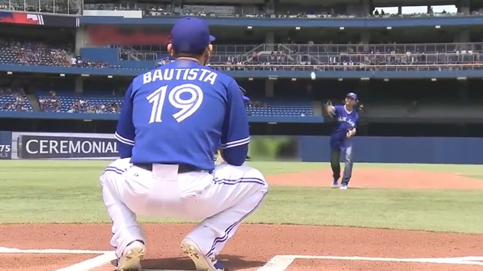 Jose Bautista Catching 1st Pitch from TD Customer at Toronto Blue Jays Game  Photo: ctvnews.com